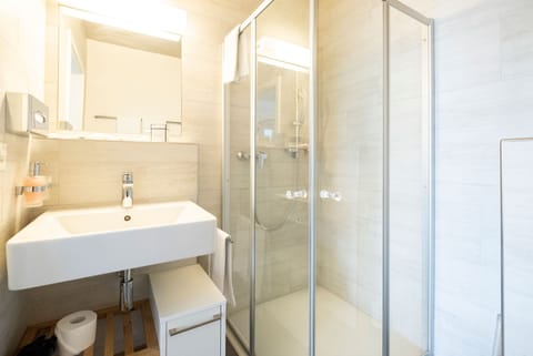 Shower, eco-friendly toiletries, hair dryer, towels