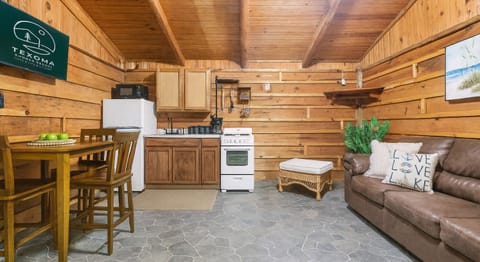 Enjoy all the comforts of home with a full kitchenette, cozy seating, and rustic charm