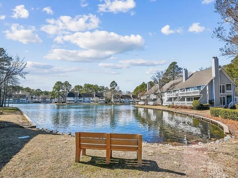 Enjoy picturesque views of the nearby lake from a peaceful bench, perfect for contemplation or relaxation amid the serene landscape of the community.