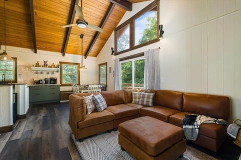 Living Room: Sun-drenched open living space with cozy decor & gorgeous views.