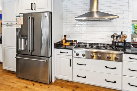Whip up gourmet meals in the sleek Kitchen with stainless-steel appliances and a 6-burner gas stove.