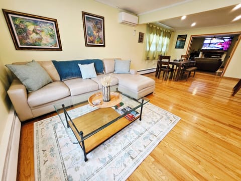 The living room has an open layout into the dining room.