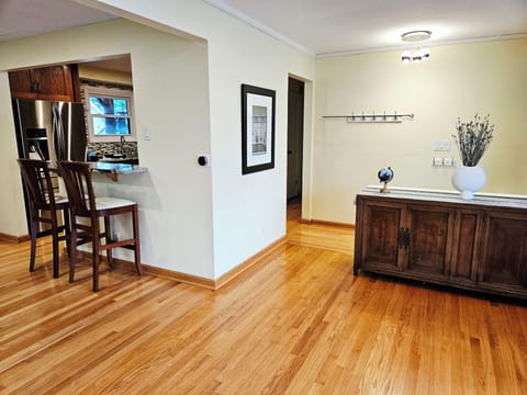 The living room has an open layout into the dining room.