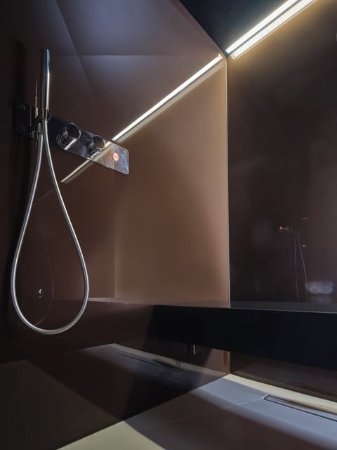 Designer toiletries, hair dryer, bathrobes, slippers