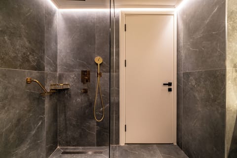 Shower, hair dryer, slippers, towels