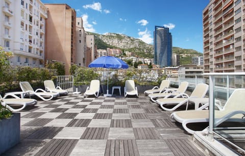 Relax under the sun on the rooftop terrace, complete with loungers and views overlooking Monaco’s skyline.