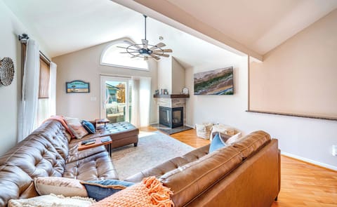 Cozy living room featuring a spacious couch, warm fireplace