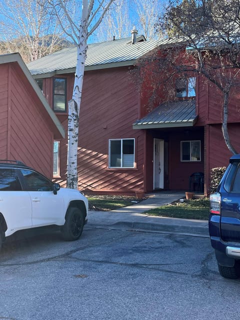 Entrance to the townhome--the white car is in the assigned parking space