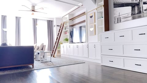 Living Room, 65" Smart TV, Crate&Barrel Sofas, Bookshelf & Cabinet