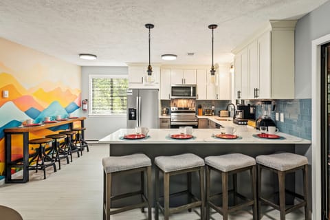 Gourmet Kitchen: Bright, inviting space with modern appliances and stylish seating for culinary adventures!