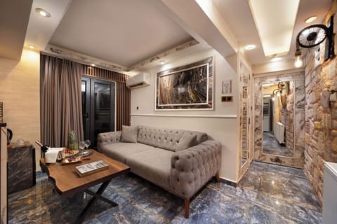 Luxury Studio Suite | Living area | 72-inch Smart TV with satellite channels, Netflix, first-run movies