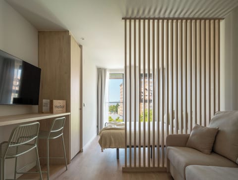 Studio | Living area | 50-inch TV with cable channels