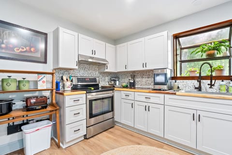 Cook, bake, or brew with ease in this thoughtfully designed kitchen. With stainless steel appliances, coffee essentials, and warm natural light, it's the perfect place to start your day or gather for a homemade meal.