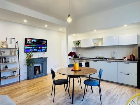Design Apartment, 2 Bedrooms, Balcony, Courtyard View | Living area | Flat-screen TV