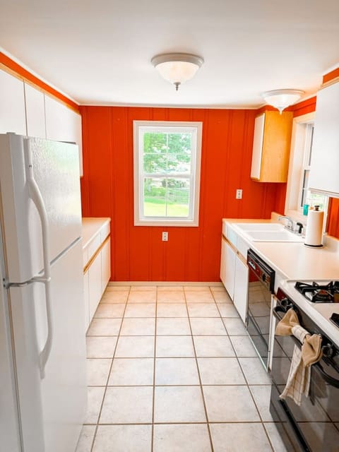 Complete kitchen setup with a dash of charm and comfort.