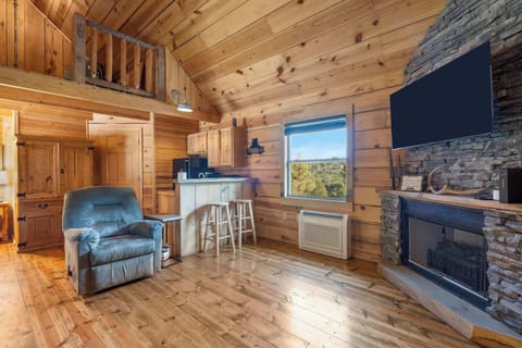 Recharge on the living room’s queen sleeper sofa & stream on the smart TV