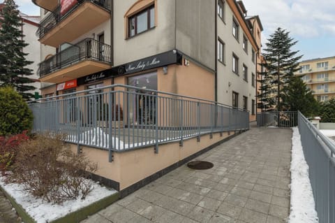 Property building situated close to the beach and near the park full of greenery.