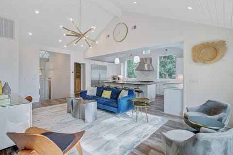 Relax in this stunning open-concept space where modern design meets comfort. Your stylish living area flows seamlessly into the gourmet kitchen.