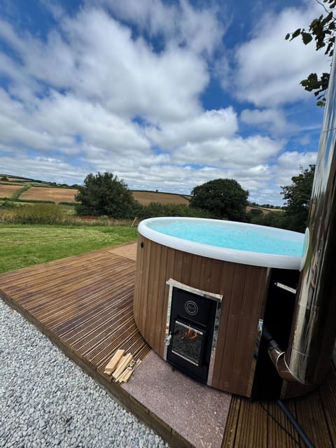 Relax in the hot tub with views of the surrounding countryside