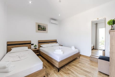 Bedroom with a double and a single bed