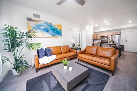 Beautifully designed living room. 65` TV, and leather sofa.