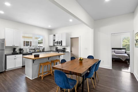 Our dining table seats 6 with an additional 2 bar seats available at our kitchen island. The perfect space to gather, share meals, and create memories with family and friends.