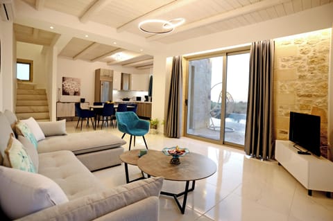 Villa, Sea View | Living area | 40-inch Smart TV with satellite channels