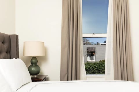Wake up to soft daylight filtering through calm, airy drapes.