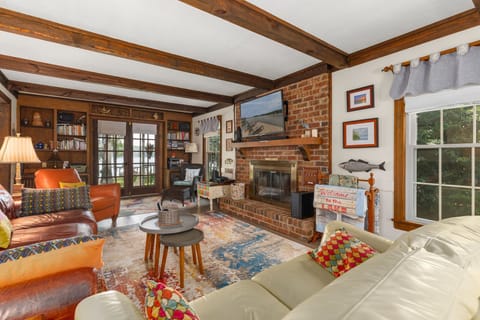 Comfy seating, 50" TV, and access to the deck.
