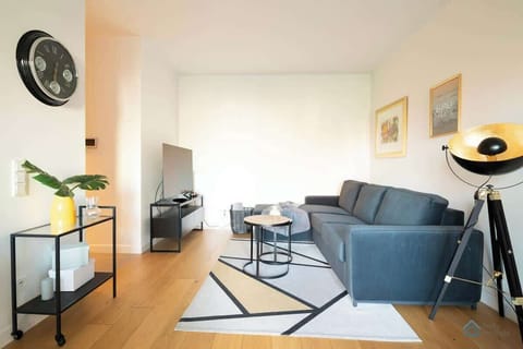 Living room with a comfortable sofa and TV. 