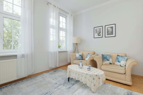A cozy sitting area with a view of greenery offers a peaceful retreat.