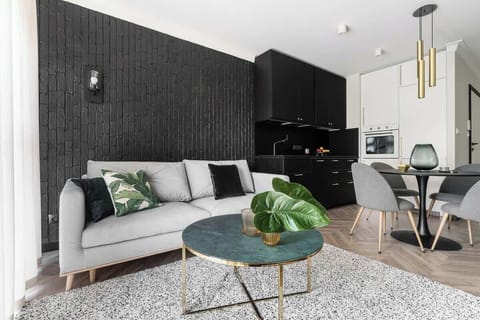 Modern sophistication, blending bold contrasts with sleek minimalism, refined elegance, and a harmonious interplay of textures, creating an inviting yet chic atmosphere.