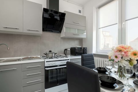 Grey kitchen with dining area.