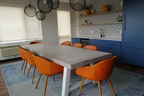 Terrace Dining Room: Gather around the chic table and enjoy meals with stunning city views!