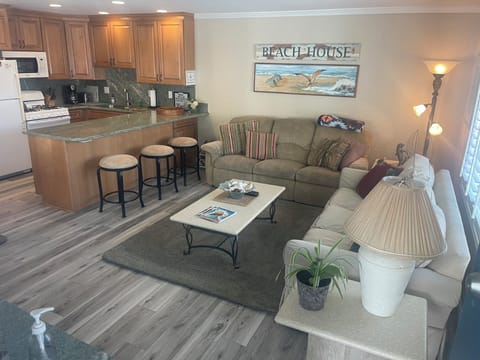 Living Room with one couch with two recliners and on sofa bed