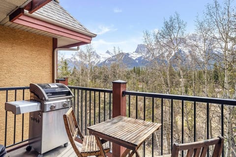 Enjoy outdoor bliss on your private patio with a BBQ and stunning mountain views.