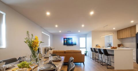 Open plan dining living with 65` smart TV