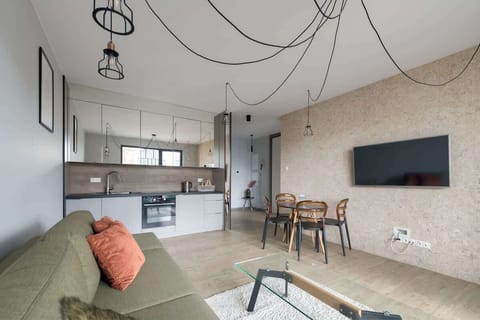 A fully equipped kitchenette with modern appliances and sleek finishes.