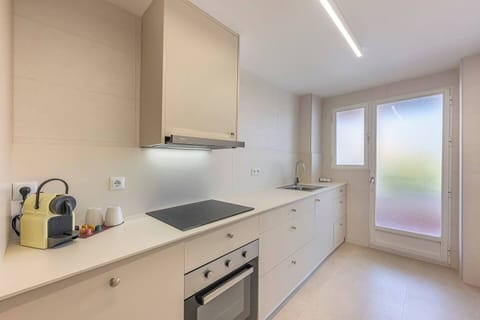 Kitchen with washer and ample storage. (2)