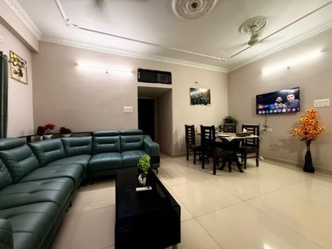 Premium Living Area: Sink into Luxury with a Stylish Sofa & Smart TV