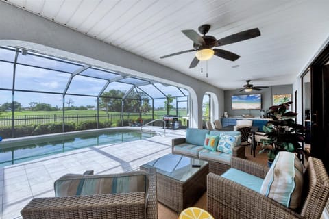 Coastal comfort meets casual elegance—golf views, heated pool, TV and wet bar.
