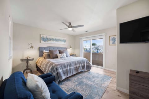 Primary Suite with balcony & Smart TV