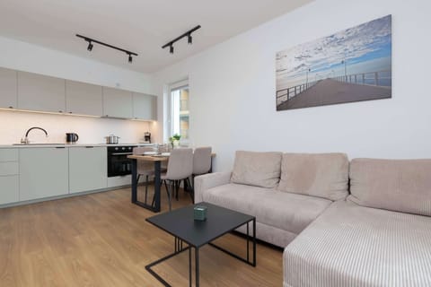 A comfortable sofa and open living space invite quality time with loved ones.