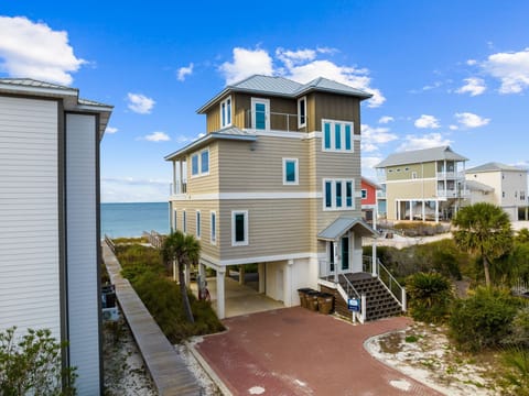 Beachfront vacation home with direct ocean access and elevated coastal views in a peaceful seaside community.