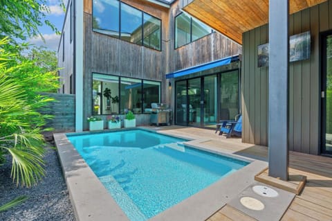 Pool area with grill access for the space to cook out and jump in the pool