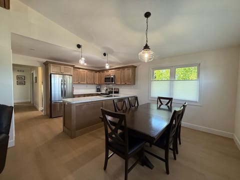 Sunny dining room opens to a modern, fully updated kitchen.