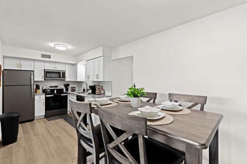 Enjoy home-cooked meals or takeout in this elegant dining area with seating for four.