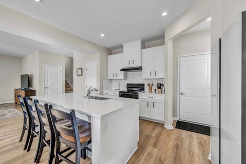 Spacious and well-equipped kitchen featuring modern appliances and all the tools you need to cook and connect with loved ones.