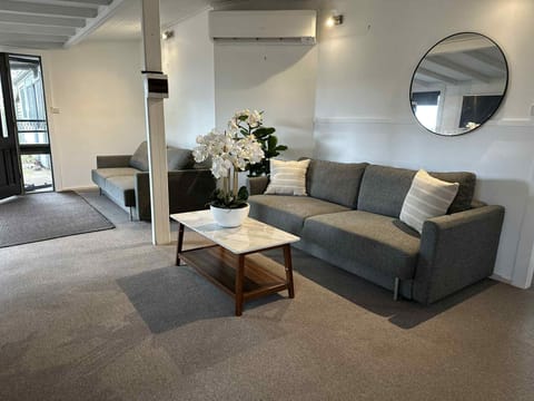Open plan living area with sofa beds