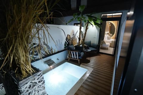 Luxury Double Room, Patio | Living area | TV